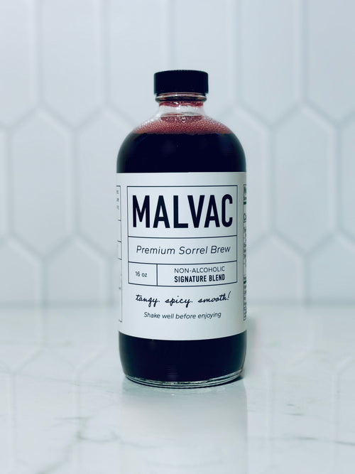 One bottle of MALVAC Premium Sorrel Brew Signature Blend on a white tiled background.