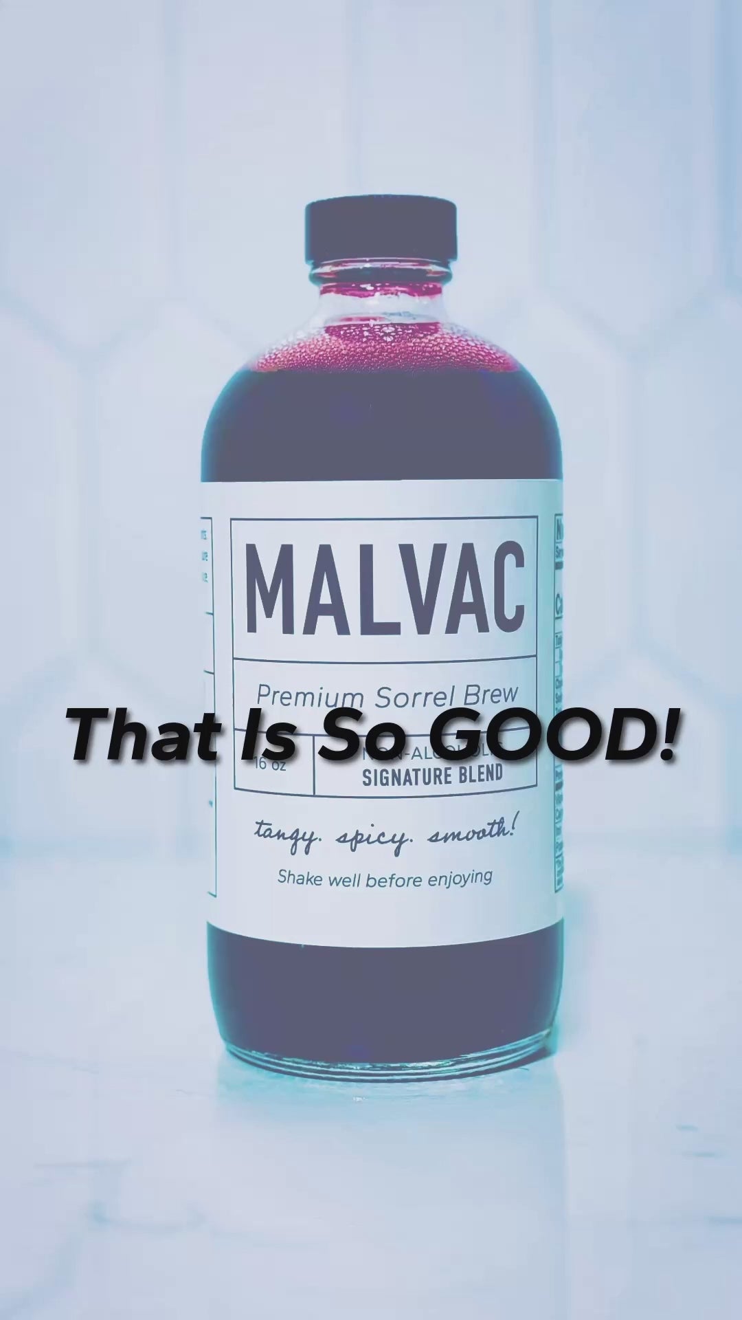 That is so good! Woman gives verbal opinion about the taste of MALVAC Premium Sorrel Brew. Ambient television and chatter in background.