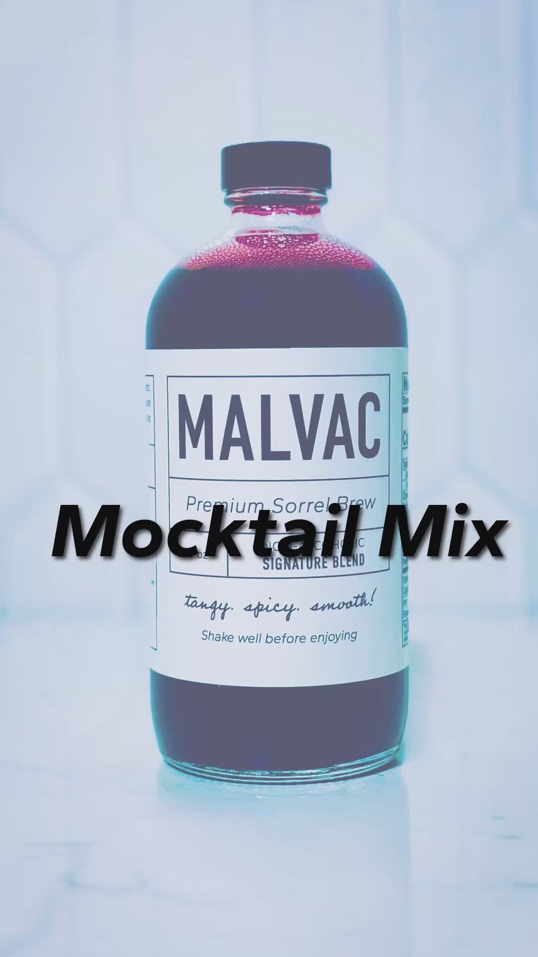 Mocktail Mix. Pouring limencello in a glass, crushing mint leaves, adding MALVAC Premium Sorrel Brew, ice, tonic water and garnishments. Music playing in the background. Plant blurred in the background. 